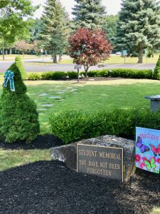 Sign in front of high school memorial garden