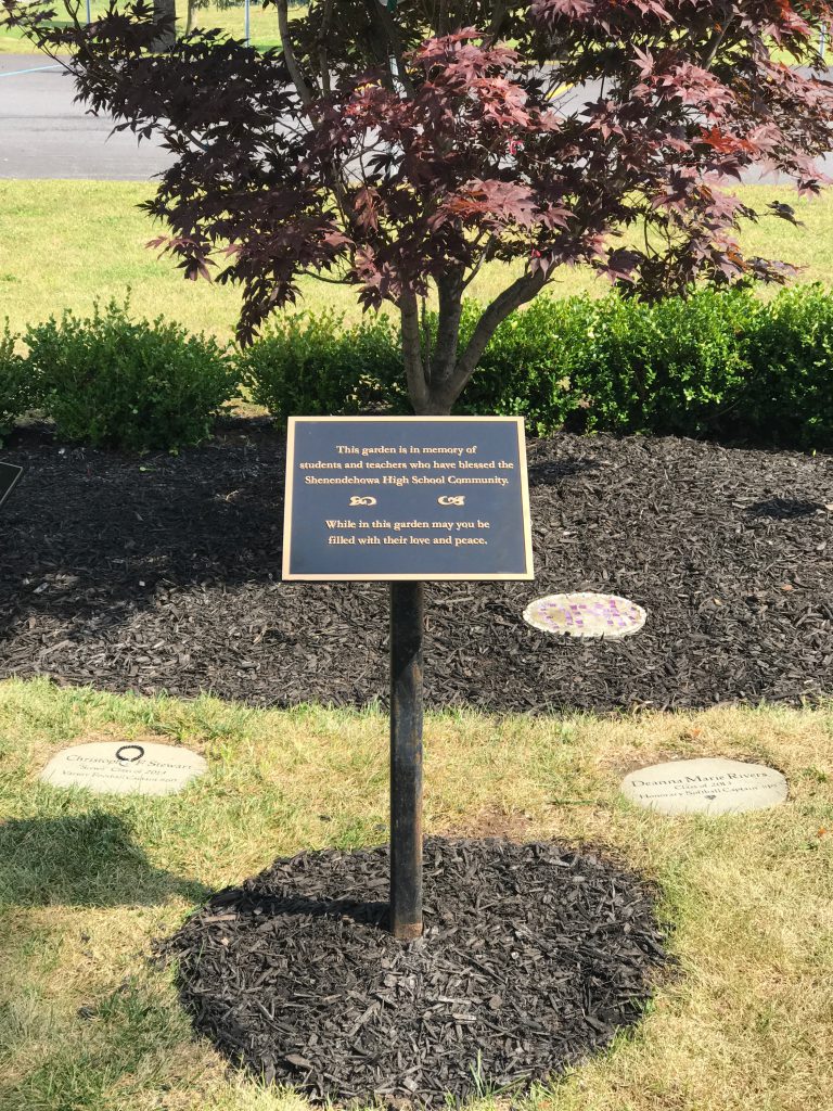 Sign in front of high school memorial garden