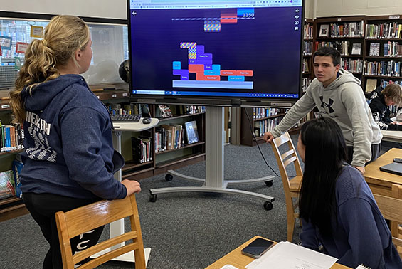 Students enjoy activities at HSW library, including AI word association, chess, World Cup geography and homework help.