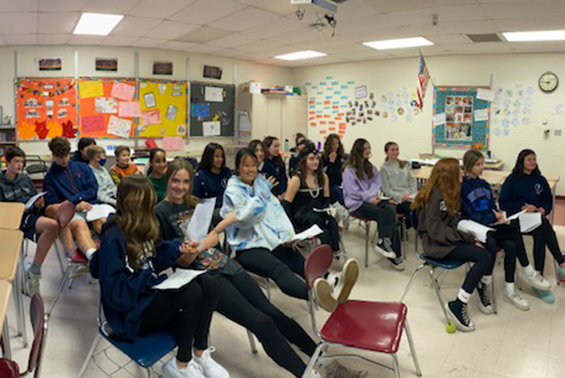 Acadia students in Mrs. Evans' English 8H class engage in a virtual book talk with Gr. 8 students from De Pere Middle School in DePere, WI. 