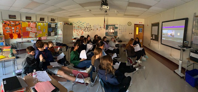 Acadia students in Mrs. Evans' English 8H class engage in a virtual book talk with Gr. 8 students from De Pere Middle School in DePere, WI. 