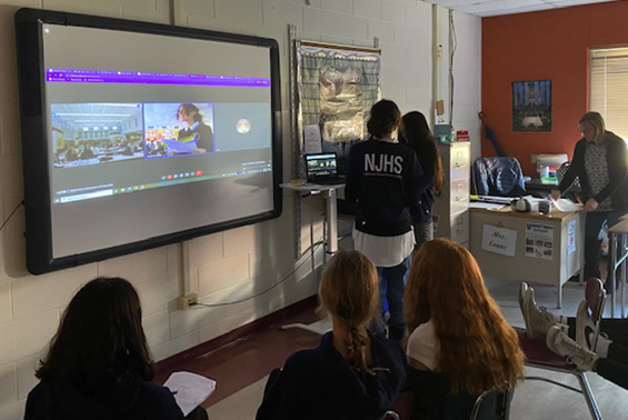 Acadia students in Mrs. Evans' English 8H class engage in a virtual book talk with Gr. 8 students from De Pere Middle School in DePere, WI. 