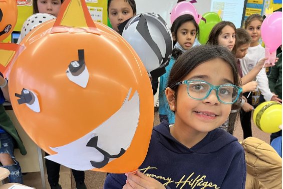 Skano third grade students designed their own balloons and paraded through the hallway after reading the book "Balloons over Broadway." 