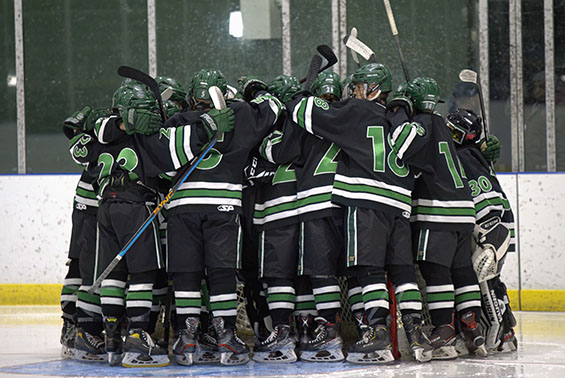 Hockey players in a huddle