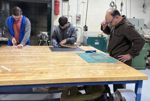 Shen High School students in Intro to Technology are building "to scale" model sheds.