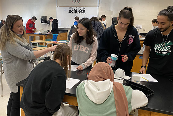 Tania Cabrera's chemistry class at HSE work on an Ice Balloon activity, assessing if the changes were exothermic or endothermic.