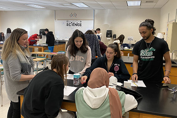Tania Cabrera's chemistry class at HSE work on an Ice Balloon activity, assessing if the changes were exothermic or endothermic.