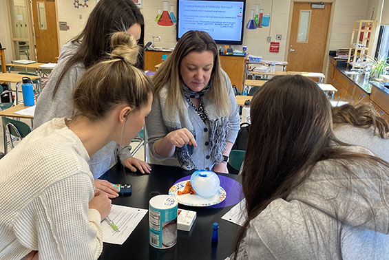 Tania Cabrera's chemistry class at HSE work on an Ice Balloon activity, assessing if the changes were exothermic or endothermic.
