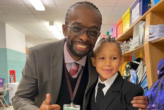 First grader, Cire Rouse, shows his Karigon school spirit on "Dress Like a Teacher or Student" Day, wearing his best Principal Jones attire!  