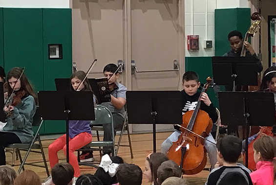 Chango's 5th grade Orchestra with Mr. Goodwin and 4th/5th grade Chorus with Mr. Poore perform for the students and staff.