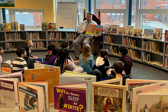 Who was Arongen's Mystery Reader in the library on January 12 for Partners in Reading?    Mrs. Patterson's third graders were thrilled to discover Mr. Hills was just as "wild about books" as he read Wild About Books by Judy Sierra to them. 