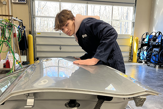 Luke working on a car