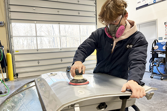 Luke working on buffing a car part
