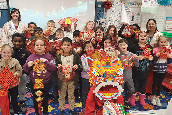 Mrs. Hou shares the culture and traditions of the Lunar New Year with Mrs. Cahill's third graders at Arongen.