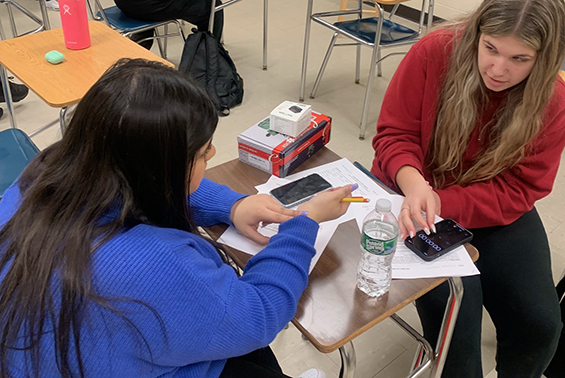 High school students in the Health Sciences for Medical Careers course practice career skills with oximeters,  sphygmomanometers, and stethoscopes.