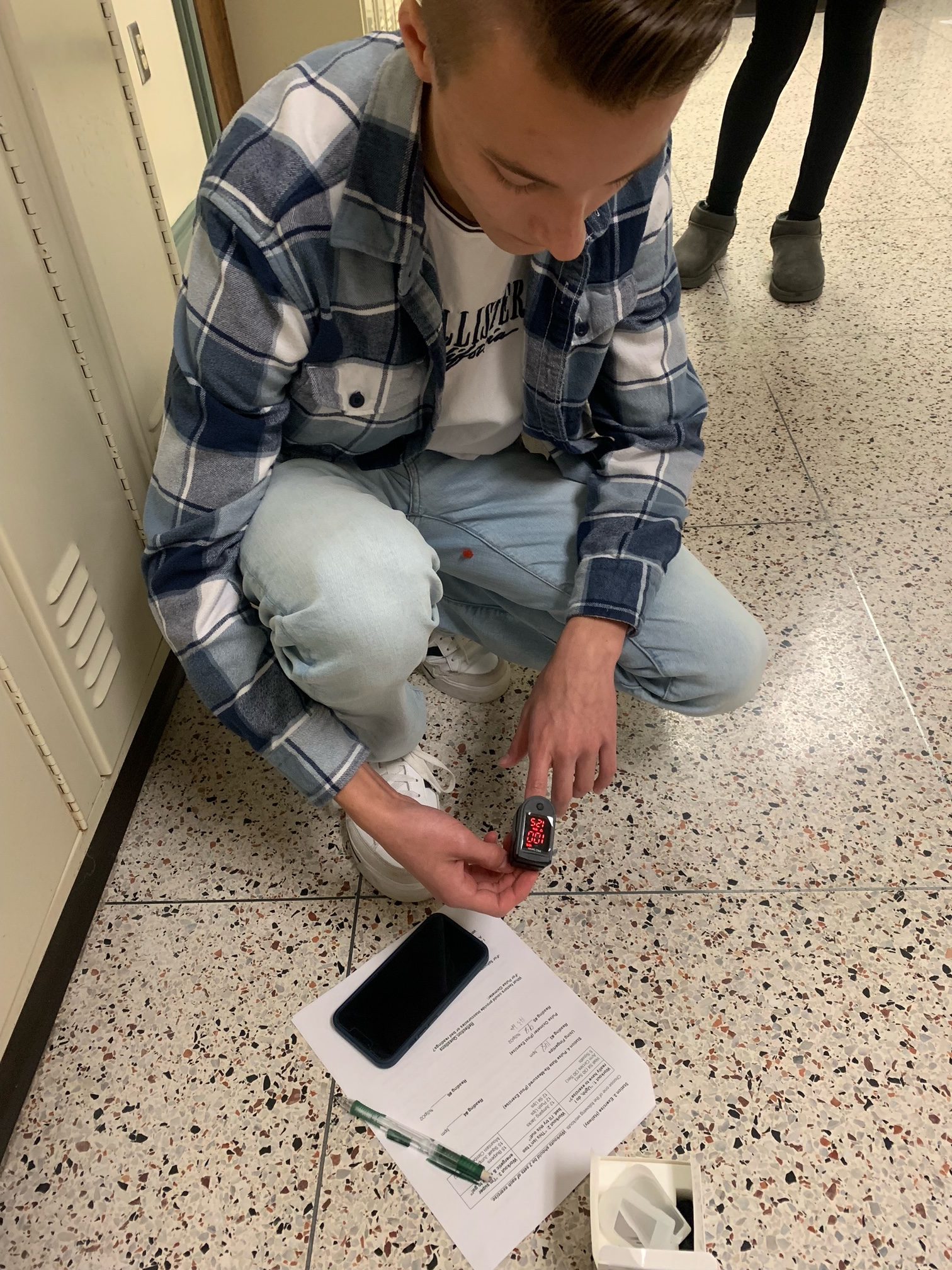 High school students in the Health Sciences for Medical Careers course practice career skills with oximeters,  sphygmomanometers, and stethoscopes.