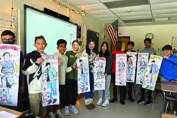 Students hold posters