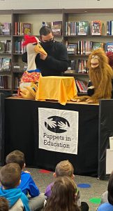 Children watch puppet show