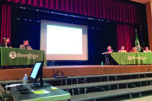 Panelists speak at mental health symposium.