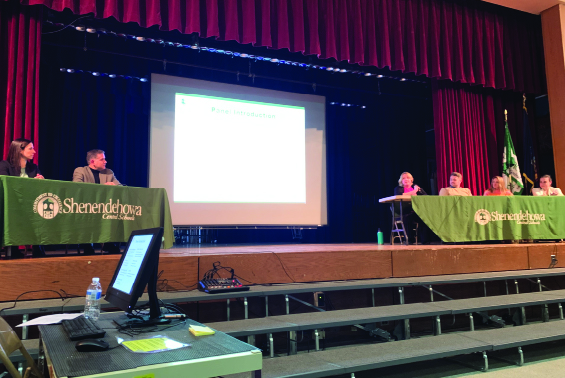 Panelists speak at mental health symposium.