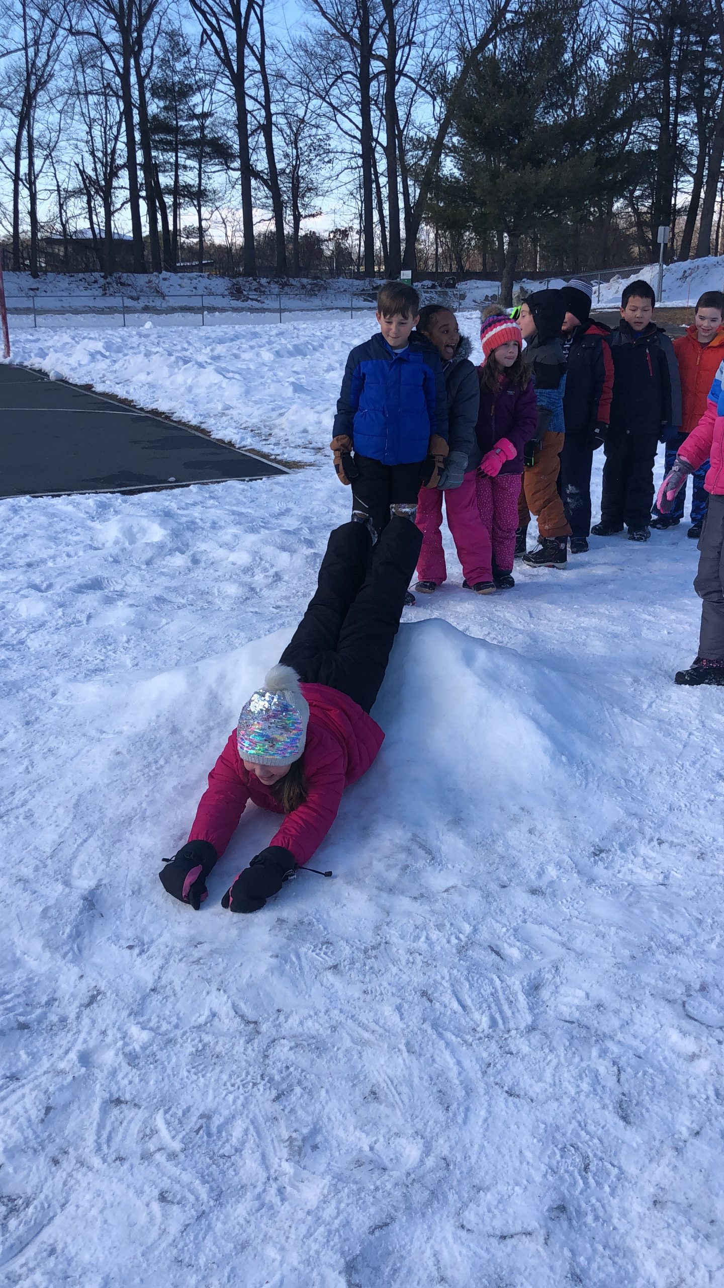 Tesago students test the new slide on the playground.
