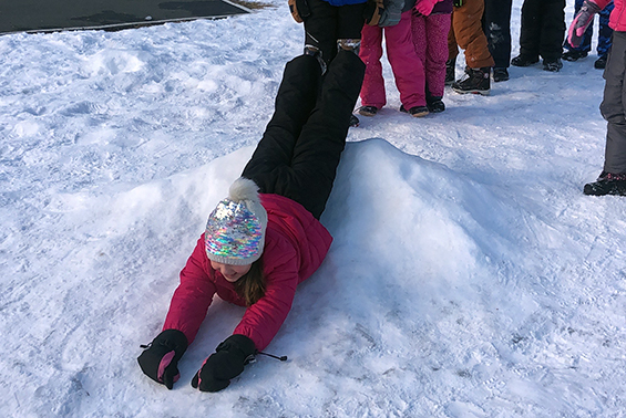 Tesago students test the new slide on the playground.