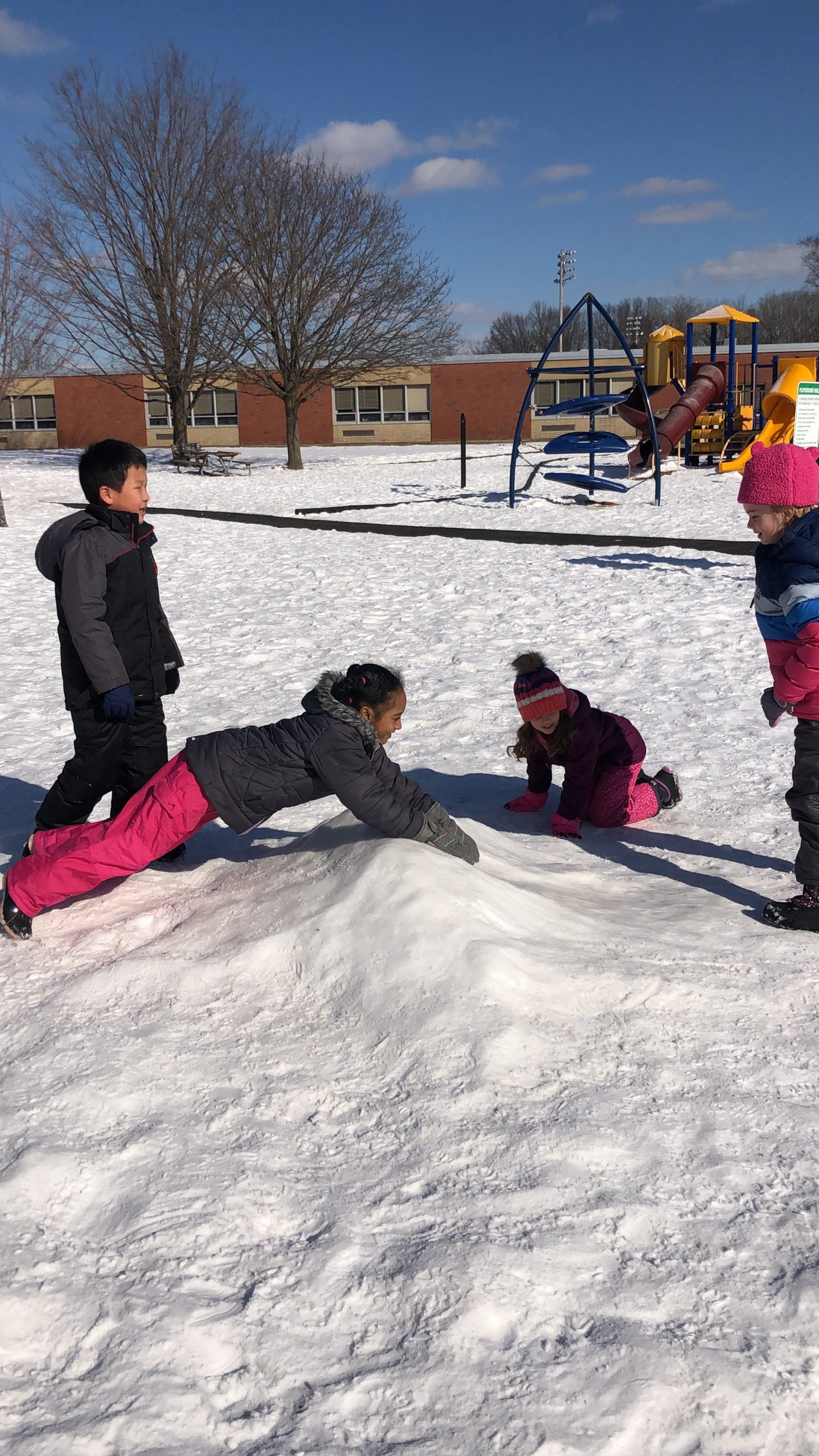 Tesago students test the new slide on the playground.