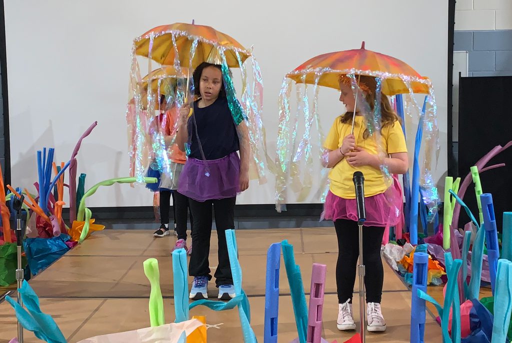 Two students dressed as jellyfish on the set of Finding Nemo.
